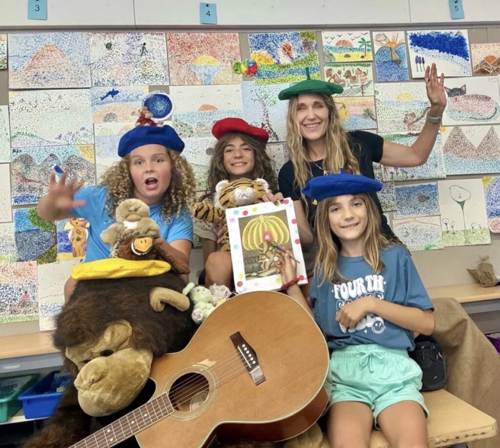 teacher and kids making art